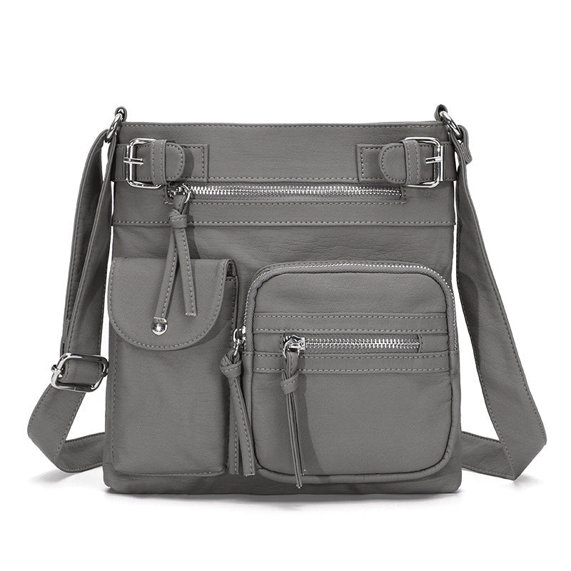 Myk crossbody-veske med flere lommer