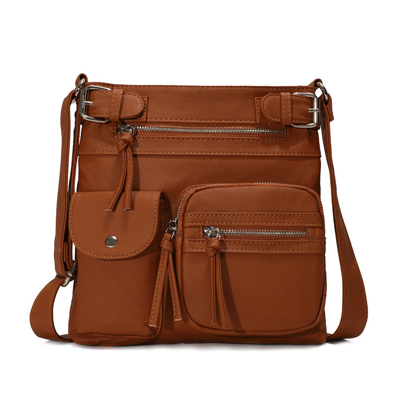 Myk crossbody-veske med flere lommer