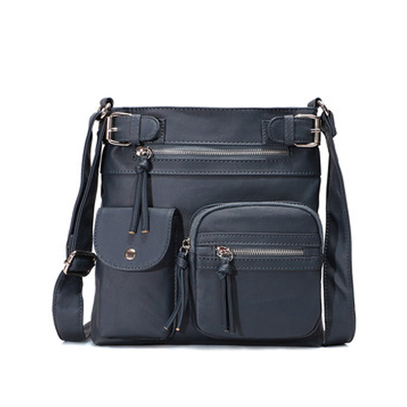 Myk crossbody-veske med flere lommer