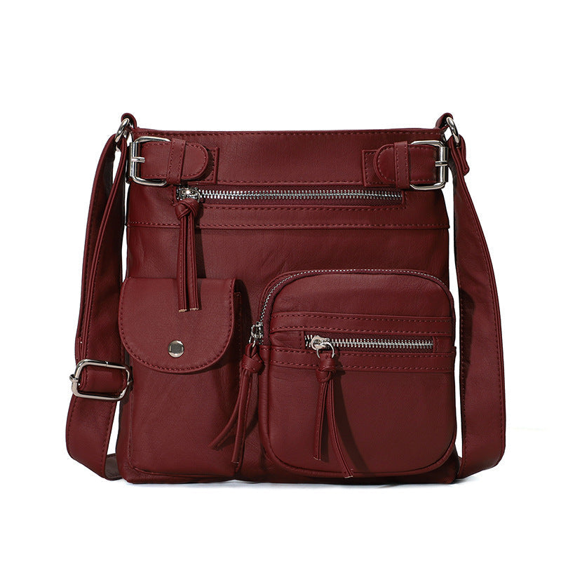 Myk crossbody-veske med flere lommer